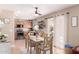 Cozy dining area with a view to the kitchen, adjacent to the kitchen, and a sliding door at 1623 W Quick Draw Way, San Tan Valley, AZ 85144