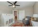 Bright bedroom with a tent, comfortable sitting chair, and closet with sliding doors at 1716 N 32Nd Pl, Phoenix, AZ 85008