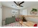 Bedroom featuring a built-in bunk bed and chair, with natural light from shuttered windows at 1716 N 32Nd Pl, Phoenix, AZ 85008