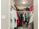 Walk-in closet with ample hanging space, shelves, and storage for shoes and accessories at 1716 N 32Nd Pl, Phoenix, AZ 85008