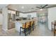 Modern kitchen featuring an island with counter seating, stainless appliances, and wood look floors at 1716 N 32Nd Pl, Phoenix, AZ 85008