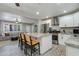 Bright kitchen features a marble island, stainless appliances, and white cabinetry at 1716 N 32Nd Pl, Phoenix, AZ 85008