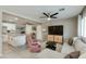 Open concept living room and kitchen with a neutral color scheme and plenty of natural light at 1716 N 32Nd Pl, Phoenix, AZ 85008