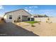 Low maintenance backyard with gravel and artificial turf at 17813 W Mission Ln, Waddell, AZ 85355