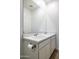 Bright bathroom featuring a double sink vanity with white cabinets and marble countertop at 17813 W Mission Ln, Waddell, AZ 85355