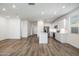 Bright kitchen featuring stainless steel appliances and center island with a sink at 17813 W Mission Ln, Waddell, AZ 85355