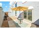 Private patio space with outdoor seating and umbrella, perfect for relaxing and enjoying the weather at 1821 W Vermont Ave, Phoenix, AZ 85015