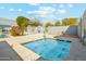Inviting in-ground spa with crystal clear water, surrounded by lush landscaping and comfortable seating at 1821 W Vermont Ave, Phoenix, AZ 85015