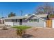 Beautiful home showcasing xeriscape front yard, walkway, and freshly painted exterior at 1934 E El Parque Dr, Tempe, AZ 85282