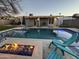 Enjoy the backyard pool area with a fire pit and comfortable seating, perfect for evening relaxation at 1934 E El Parque Dr, Tempe, AZ 85282