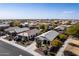 A neighborhood aerial featuring a single-story home with desert landscaping and a large driveway at 2108 E Lindrick Dr, Gilbert, AZ 85298