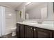 Bathroom featuring a vanity, sink, mirror, toilet, and bathtub with shower at 2108 E Lindrick Dr, Gilbert, AZ 85298