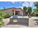 Well-equipped outdoor kitchen with a built-in grill and counter space at 21998 N Greenland Park Dr, Maricopa, AZ 85139