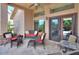 Cozy outdoor patio with comfortable seating and ceiling fan at 21998 N Greenland Park Dr, Maricopa, AZ 85139