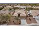 An aerial view of a single-story home showing the roof, backyard, and surrounding neighborhood at 22065 W Twilight Trl, Buckeye, AZ 85326