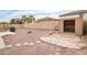 View of a backyard featuring a shed and desert landscaping for low maintenance at 22065 W Twilight Trl, Buckeye, AZ 85326