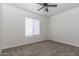 Bedroom featuring horizontal blinds, neutral paint and carpeting with ceiling fan at 22065 W Twilight Trl, Buckeye, AZ 85326