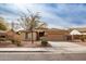 Charming single-story home with a well-maintained front yard and a two-car garage at 22065 W Twilight Trl, Buckeye, AZ 85326