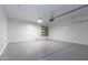 View of a garage with painted floors, shelving, and a water heater at 22065 W Twilight Trl, Buckeye, AZ 85326