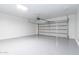 Spacious two-car garage with epoxy flooring and an automatic garage door offers both functionality and sleek design at 22065 W Twilight Trl, Buckeye, AZ 85326