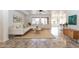 Bright living room featuring tile floors, a comfortable sectional sofa, and modern decor at 22065 W Twilight Trl, Buckeye, AZ 85326