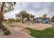 Community playground offering swing sets, slides, and play area in a park-like setting at 22065 W Twilight Trl, Buckeye, AZ 85326