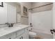 Cozy bathroom with marble countertops, updated fixtures, and shower-tub combo at 2284 N 161St Ave, Goodyear, AZ 85395