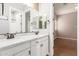 Dual sink bathroom vanity and an adjoining bedroom, offering convenience and space at 2284 N 161St Ave, Goodyear, AZ 85395