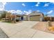 Single-story home boasts charming curb appeal, desert landscaping, and a two-car garage at 2284 N 161St Ave, Goodyear, AZ 85395