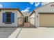 Charming front entrance with gated courtyard and a two-car garage on each side at 2284 N 161St Ave, Goodyear, AZ 85395