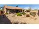 Wide angle of the backyard with decorative rock and lush landscaping at 23935 S Sunvista Dr, Sun Lakes, AZ 85248