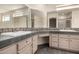 Bright bathroom with dual sinks, tile countertops, vanity, and lots of mirror space at 23935 S Sunvista Dr, Sun Lakes, AZ 85248