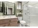 Updated bathroom featuring a vanity, sink, toilet, and modern glass shower at 23935 S Sunvista Dr, Sun Lakes, AZ 85248