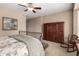Bedroom with large wood dresser, carpet flooring and neutral colored walls at 23935 S Sunvista Dr, Sun Lakes, AZ 85248