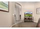 Open hallway featuring neutral paint, tiled floors and decor, with a TV in the corner at 23935 S Sunvista Dr, Sun Lakes, AZ 85248