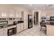 Functional kitchen with granite countertops, stainless steel appliances, and ample storage at 23935 S Sunvista Dr, Sun Lakes, AZ 85248
