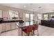 Bright kitchen with island seating open to dining and living areas at 23935 S Sunvista Dr, Sun Lakes, AZ 85248