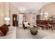 Open floor plan showcasing a sitting area, dining table, and stylish furnishings at 23935 S Sunvista Dr, Sun Lakes, AZ 85248