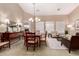 Spacious living/dining area with plenty of seating, a dining table, and natural light at 23935 S Sunvista Dr, Sun Lakes, AZ 85248