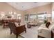 Combined living and dining area with ample natural light and modern decor at 23935 S Sunvista Dr, Sun Lakes, AZ 85248