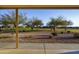 Well-manicured backyard with desert landscaping including gravel, shrubs, and trees at 2662 S Springwood Blvd # 467, Mesa, AZ 85209