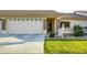Charming single-story home featuring a two-car garage, desert landscaping, and a welcoming front porch at 2662 S Springwood Blvd # 467, Mesa, AZ 85209