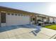 Attractive single-story home with a two-car garage, well-maintained lawn, and a cozy front entryway at 2662 S Springwood Blvd # 467, Mesa, AZ 85209