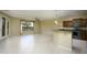 Open-concept living area with tile floors, natural light, ceiling fan, and seamless access to kitchen at 2662 S Springwood Blvd # 467, Mesa, AZ 85209