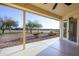 View of the patio looking out at the well-manicured lawn, mature trees, and clear sky at 2662 S Springwood Blvd # 467, Mesa, AZ 85209