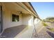 Patio featuring concrete tile, ceiling fan, and views of desert landscaping at 2662 S Springwood Blvd # 467, Mesa, AZ 85209