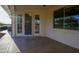 Covered patio with a desert motif screen door and large window overlooking the backyard landscape at 2662 S Springwood Blvd # 467, Mesa, AZ 85209