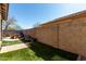 Enclosed backyard featuring synthetic grass, a patio, privacy walls, and a picnic table perfect for outdoor gatherings at 273 S 152Nd Ave, Goodyear, AZ 85338