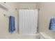Clean bathroom featuring a tub with shower and neutral colored walls at 273 S 152Nd Ave, Goodyear, AZ 85338