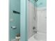 Modern bathroom with a sleek, white shower featuring updated fixtures and bright blue accent wall, creating a spa-like experience at 273 S 152Nd Ave, Goodyear, AZ 85338